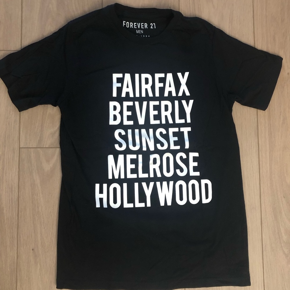 Men’s T-shirt Forever 21 in black with white graphic in front. Size Medium